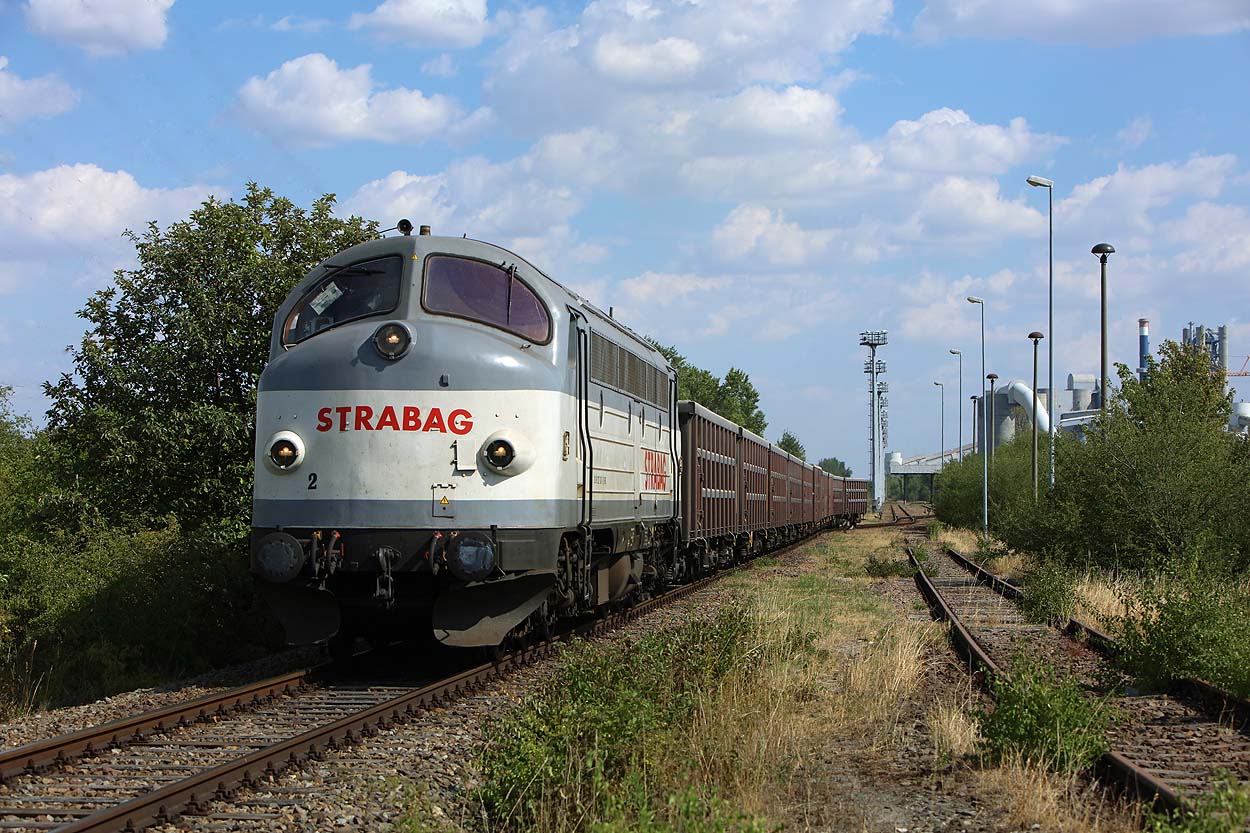 Strabag roundnose 1227 007 departs the industrial siding at Bernburg (D) with a cement klinker train towards Köthen on 25 July 2018.